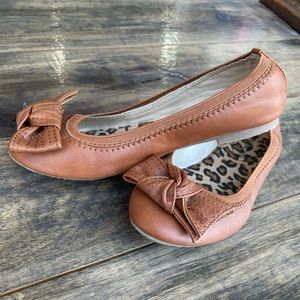 Brown Flats with a bow toe accent